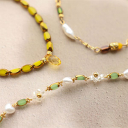 NEW Beautiful new oval glass beads with gold rim