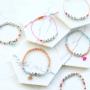 Quote jewellery with letter beads metal look and colourful details