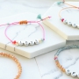 Quote jewellery with letter beads metal look and colourful details