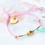 Summery bracelets with coloured elastic cord and colourful beads