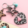 Keychains with pendants faux leather hairy, stainless steel and cheerful tassels