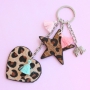 Keychains with pendants faux leather hairy, stainless steel and cheerful tassels