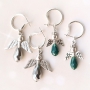 Angels with top faceted drop shaped beads and metal wings
