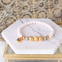 Bracelets and earrings with botanical colours and golden details