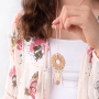 Festival jewellery inspiration with feathers and rattan pendants