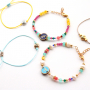 Easily create jewellery with zodiac sign beads and macram&eacute; bead cord: