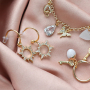 Trendy earrings and bracelets with zirconia charms and connectors: