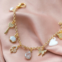 Trendy earrings and bracelets with zirconia charms and connectors: