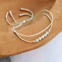 Get creative with mini beads and jump rings to make stylish jewellery
