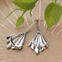 Earring inspiration with golden and silver charms and connectors