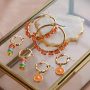 Design an earring collection with stainless steel creoles