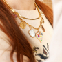 Create a funky charm necklace with metal charms with enamel